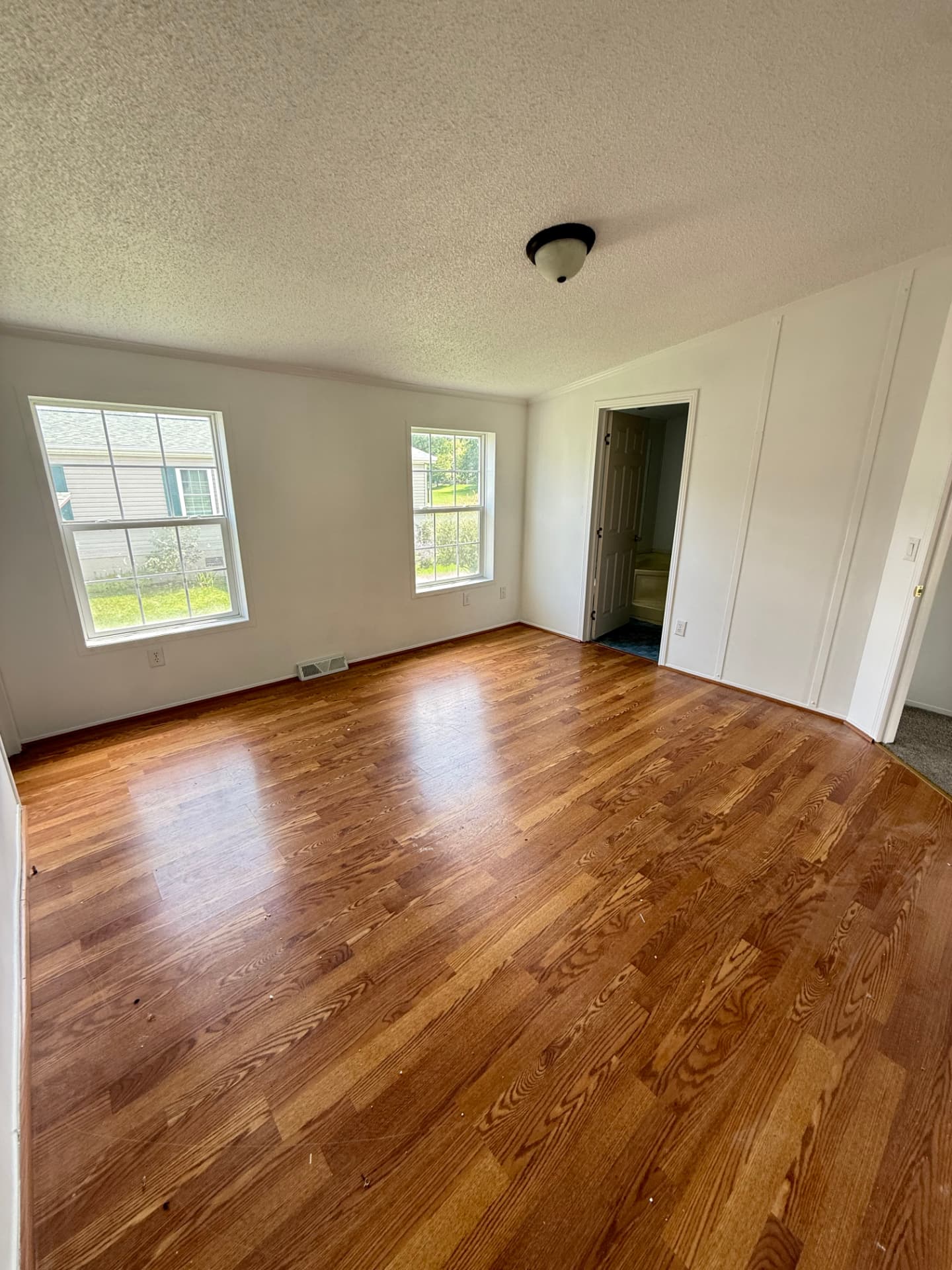 Bedroom at 40 Michael with hardwood floors and two windows