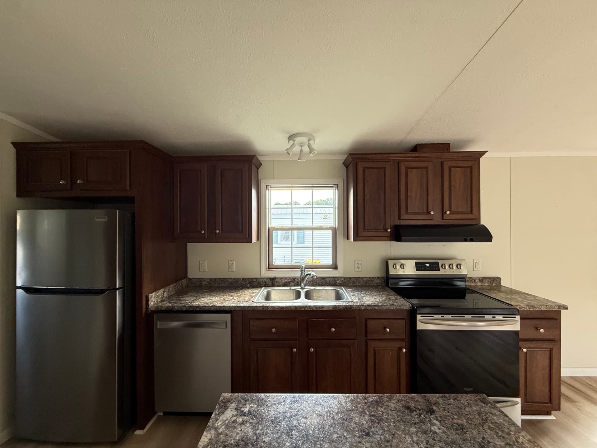 Kitchen at 15 Kevin with full appliance package and window over the sink
