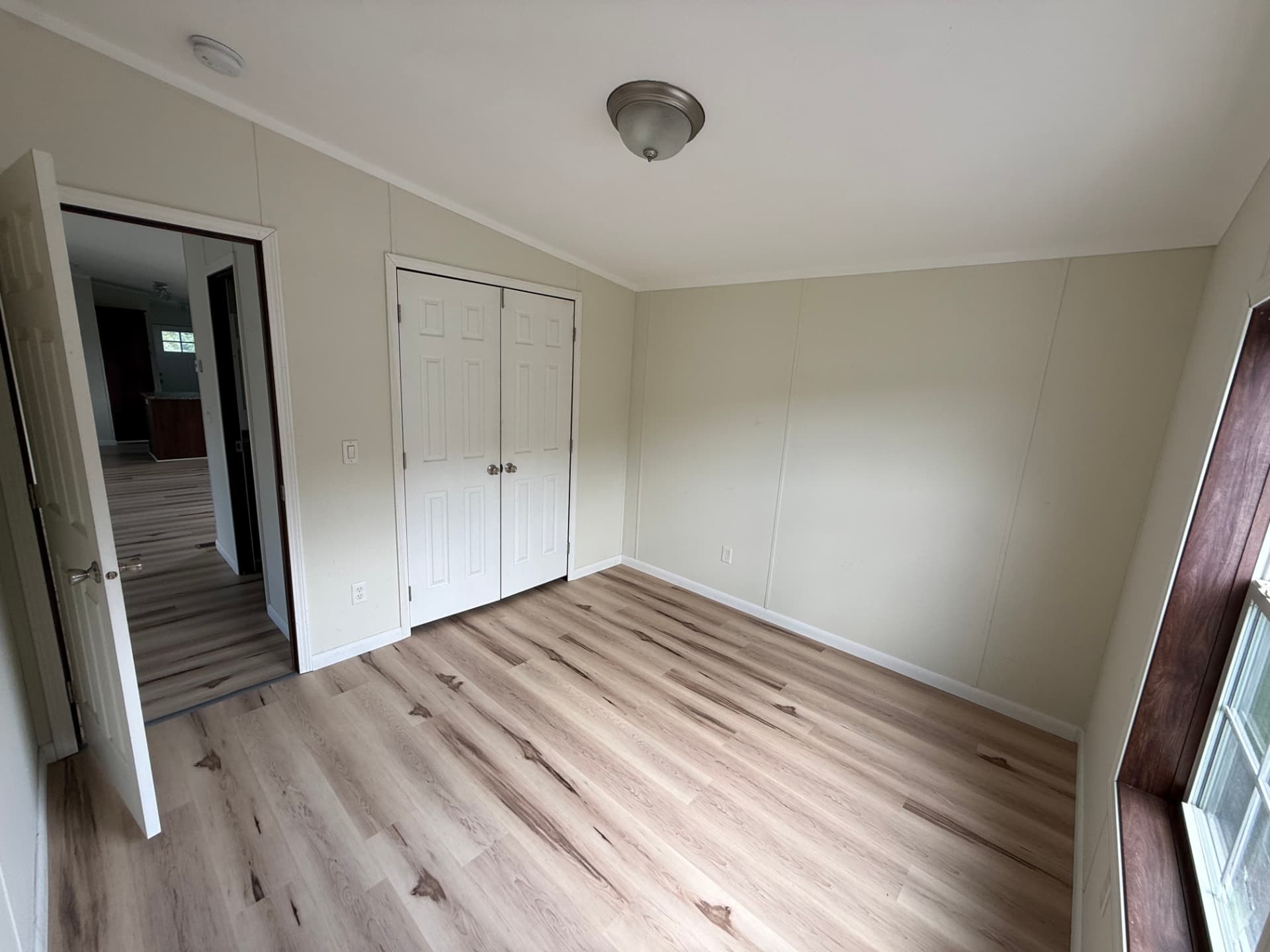 Bedroom at 15 Kevin with double closet and wood-look flooring