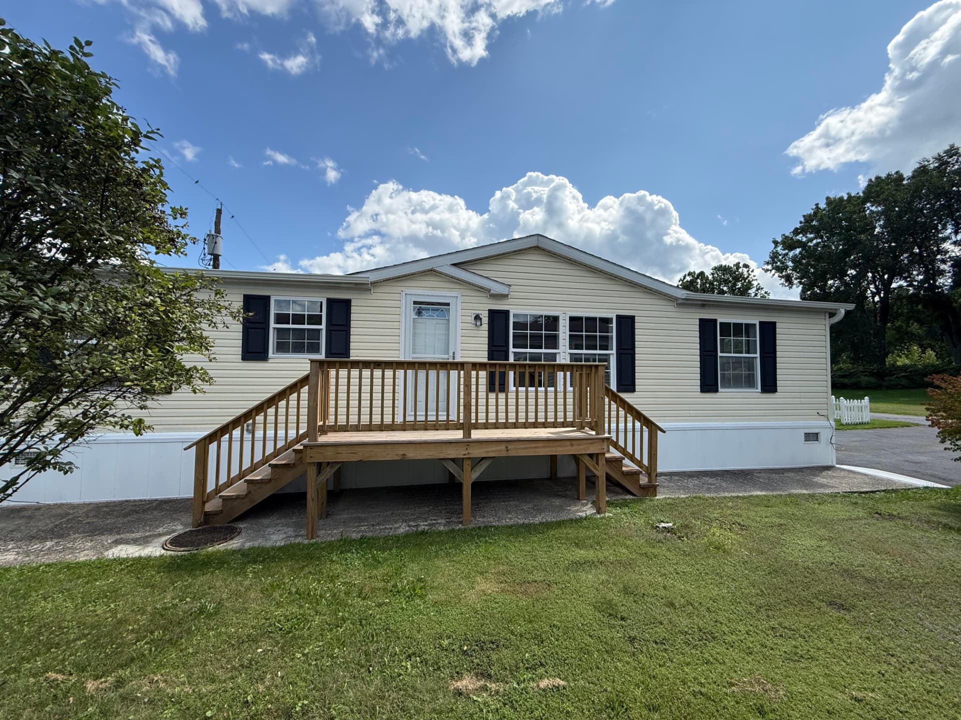 Front exterior of 40 Michael with a new wood deck and stairs